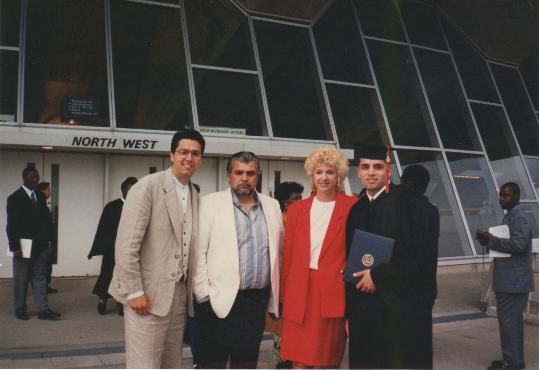Graduation day — Tony, Dad, Mom, and me.